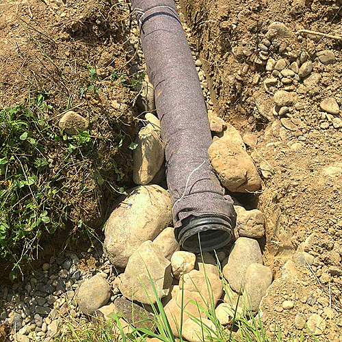 water draining pipe in the blueberry orchard